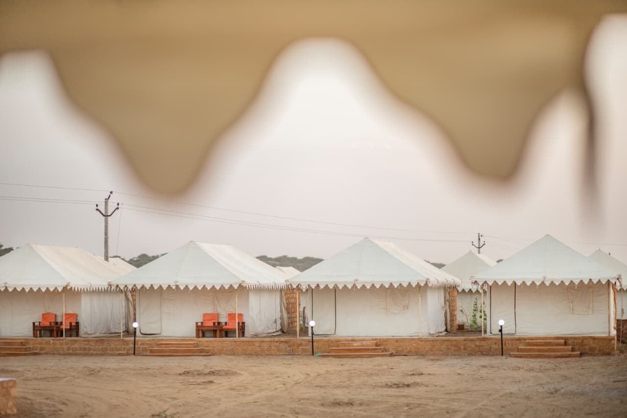 Deluxe Swiss tents lined along the sand at Sam Sand Dunes, Jaisalmer